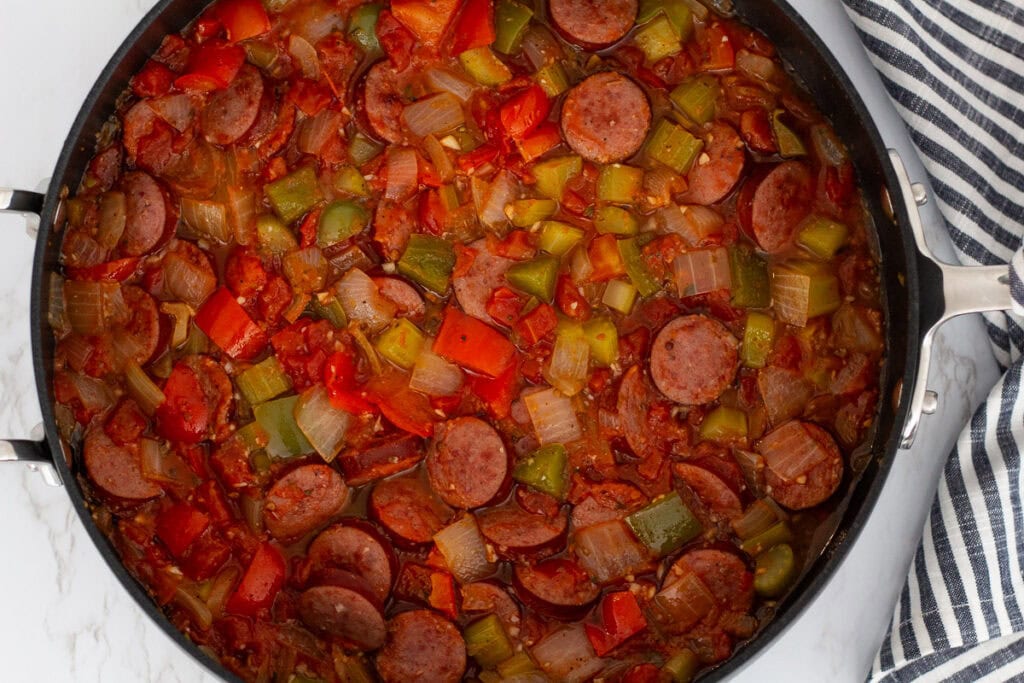 Cajun sausage stew base with sautéed onions, celery, bell peppers, and tomatoes.