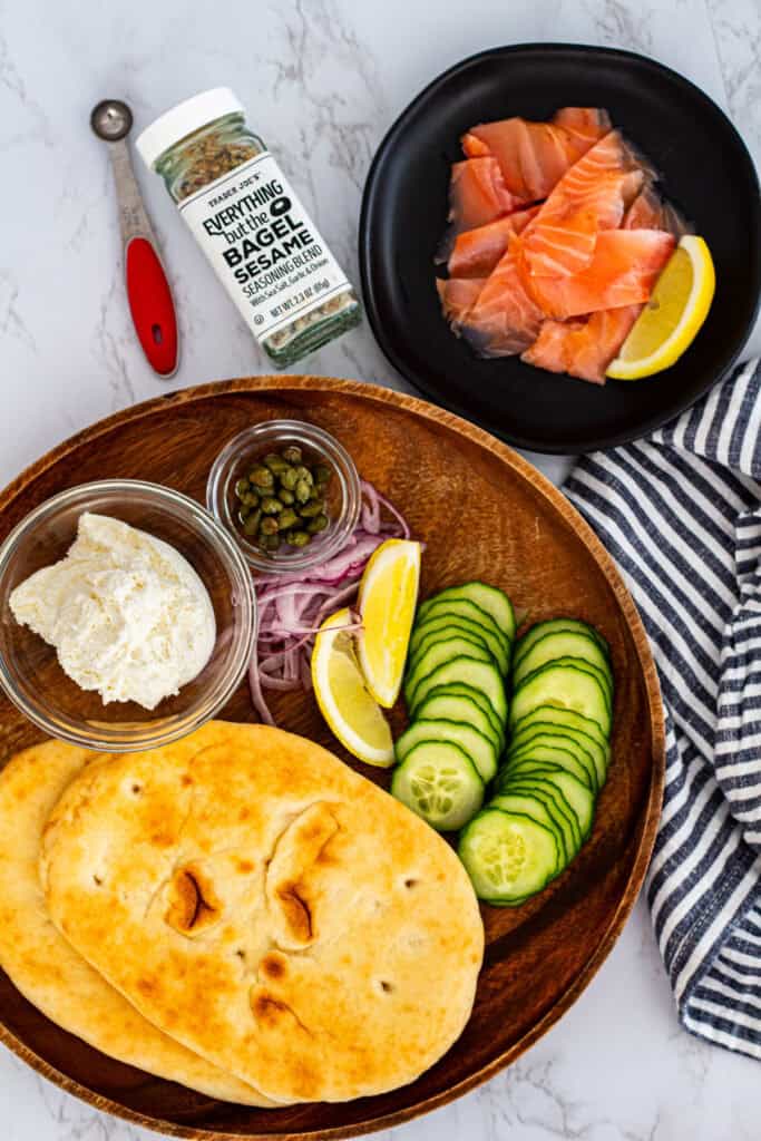 Flatbread, smoked salmon, cream cheese, capers, cucumber, lemon, and red onion for smoked salmon flatbread.