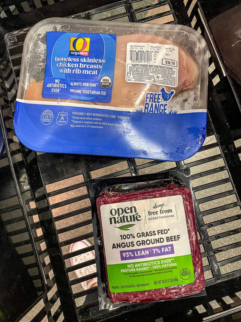 One pound packages of chicken breast and ground beef showing realistic protein portion size for cooking for two meals