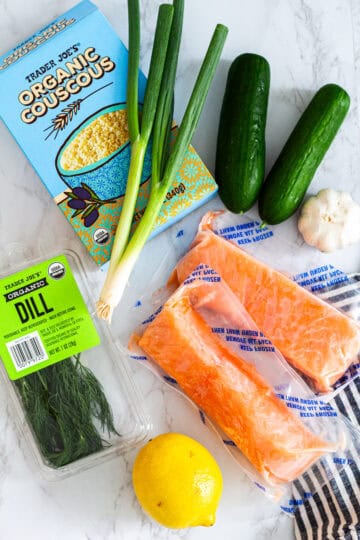 Ingredients for a simple portion guide including salmon, couscous, cucumbers, green onion, dill, lemon, and garlic for cooking for two without waste