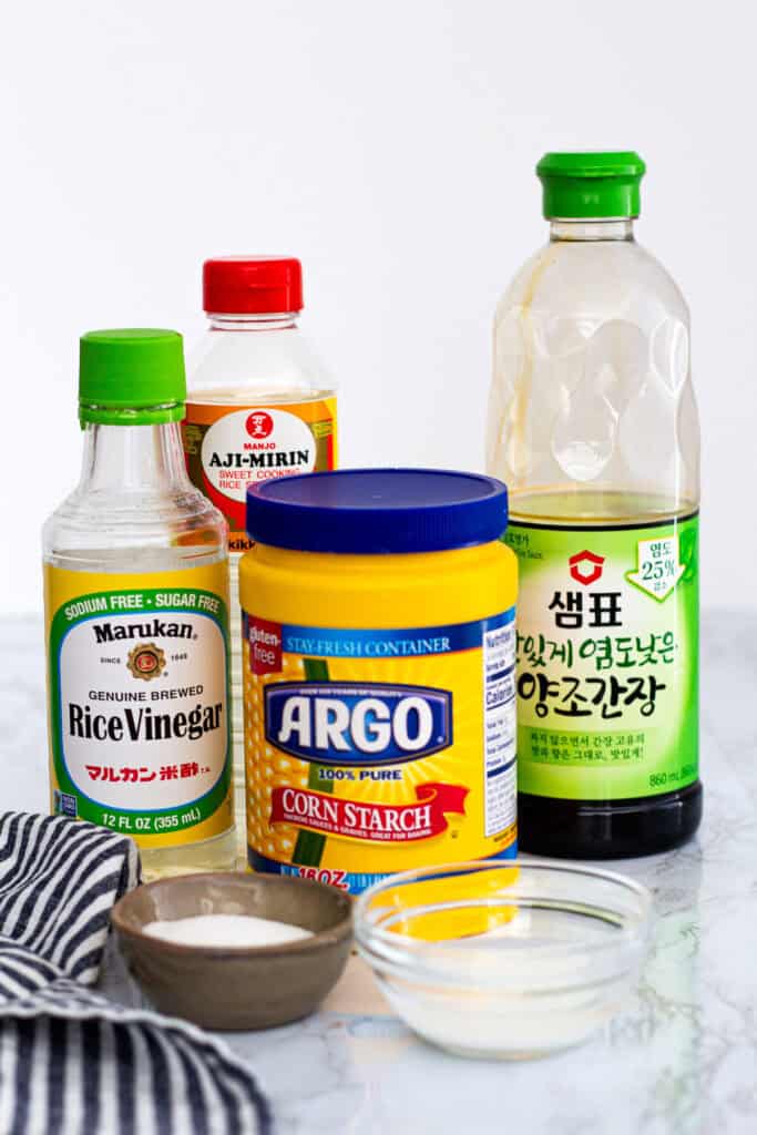 ingredients for homemade teriyaki sauce including soy sauce, mirin, rice vinegar, sugar, and cornstarch