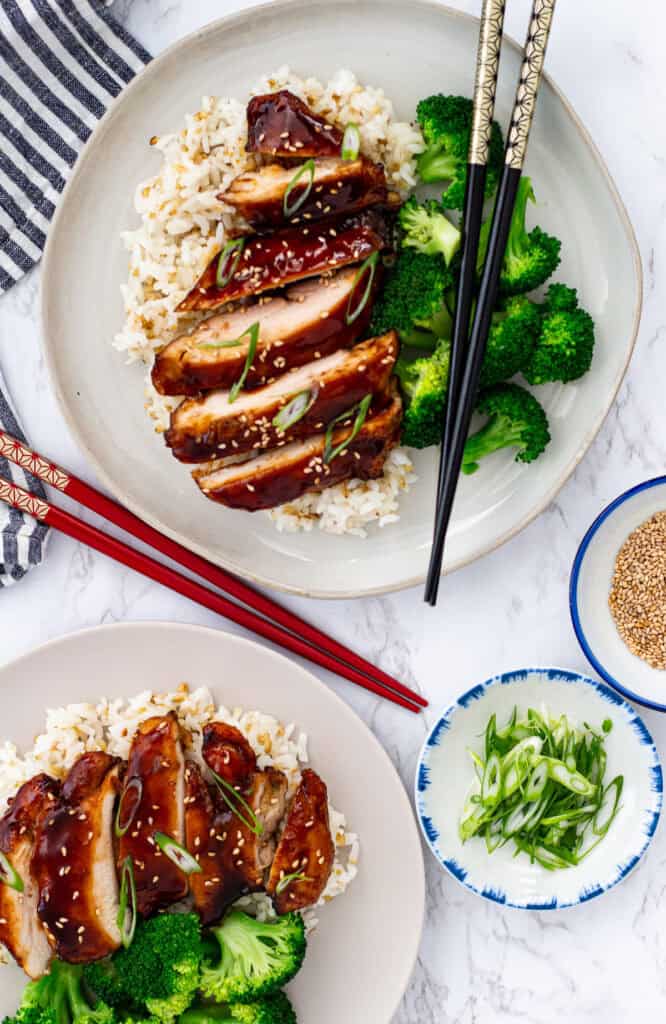 air fryer teriyaki chicken thighs served with rice broccoli sesame seeds and green onions