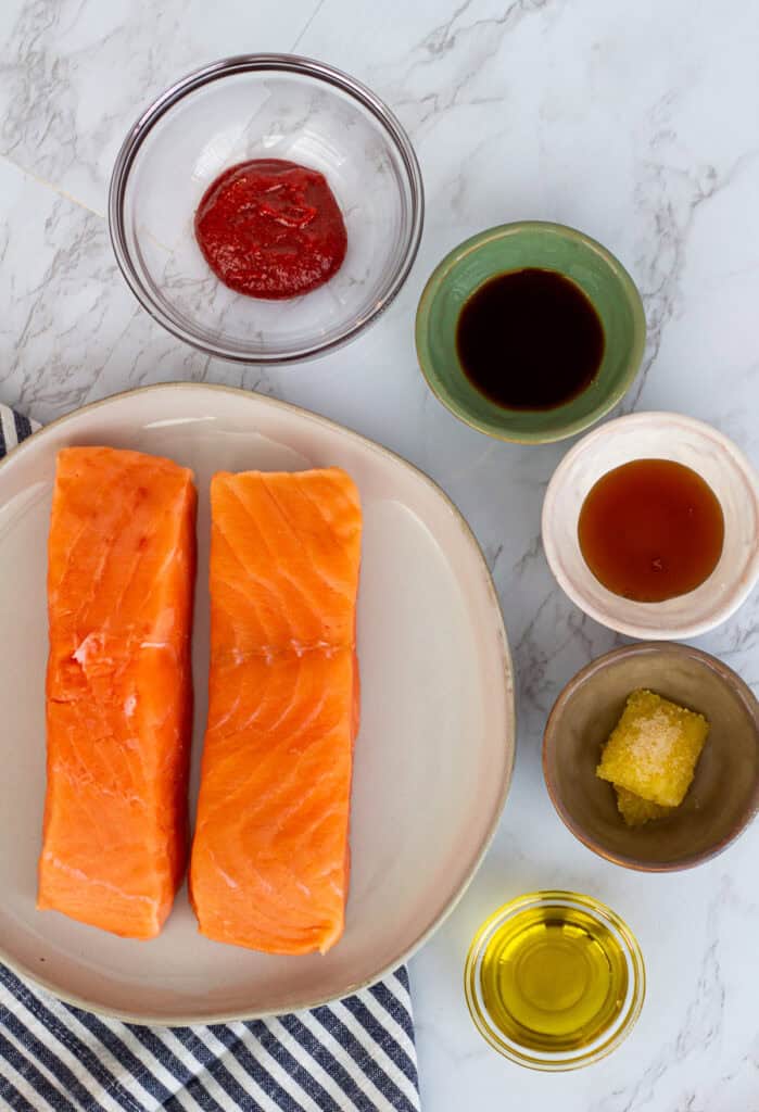 raw salmon fillets with gochujang, soy sauce, honey, garlic, and oil for glaze