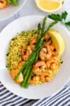 Close-up of shrimp and couscous with lemon and herbs