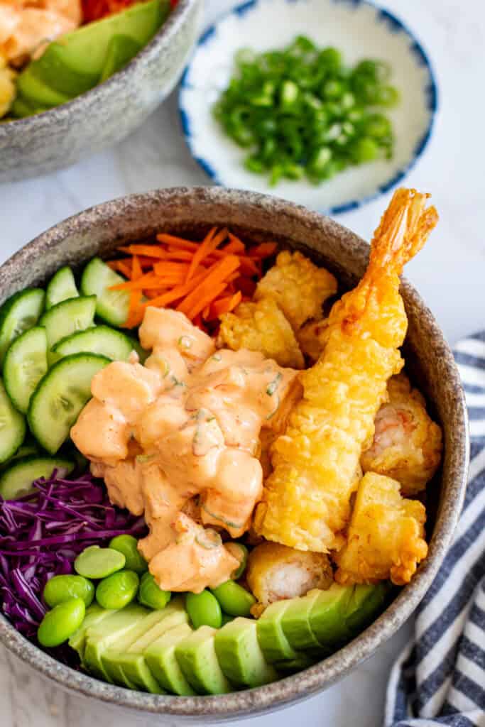 shrimp poke bowl with spicy mayo shrimp, tempura shrimp, rice, and fresh vegetables