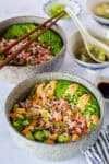 Two California Roll Bowls served with easy miso soup, soy sauce, and wasabi for a simple sushi-inspired meal at home.