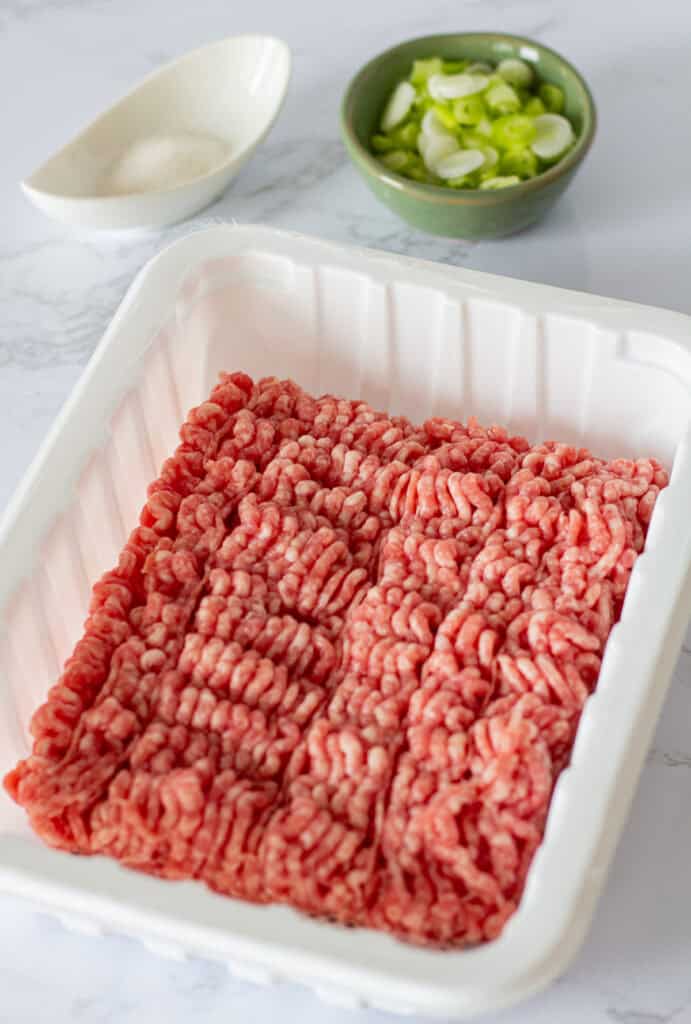 Ground pork with green onions and sugar for making gochujang ground pork.