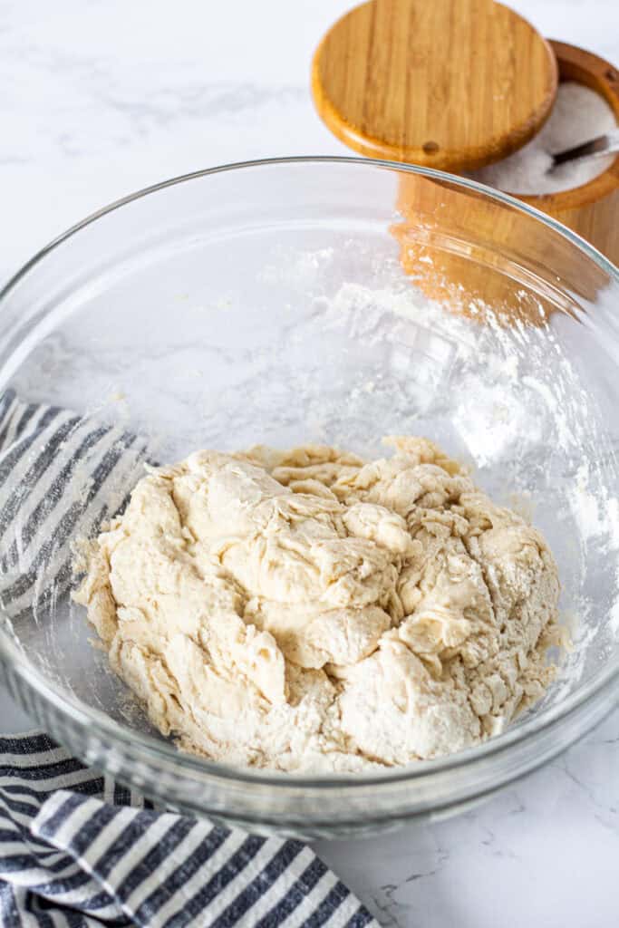 Shaggy small batch pizza dough after mixing the flour, yeast, sugar, and water, before adding the salt.