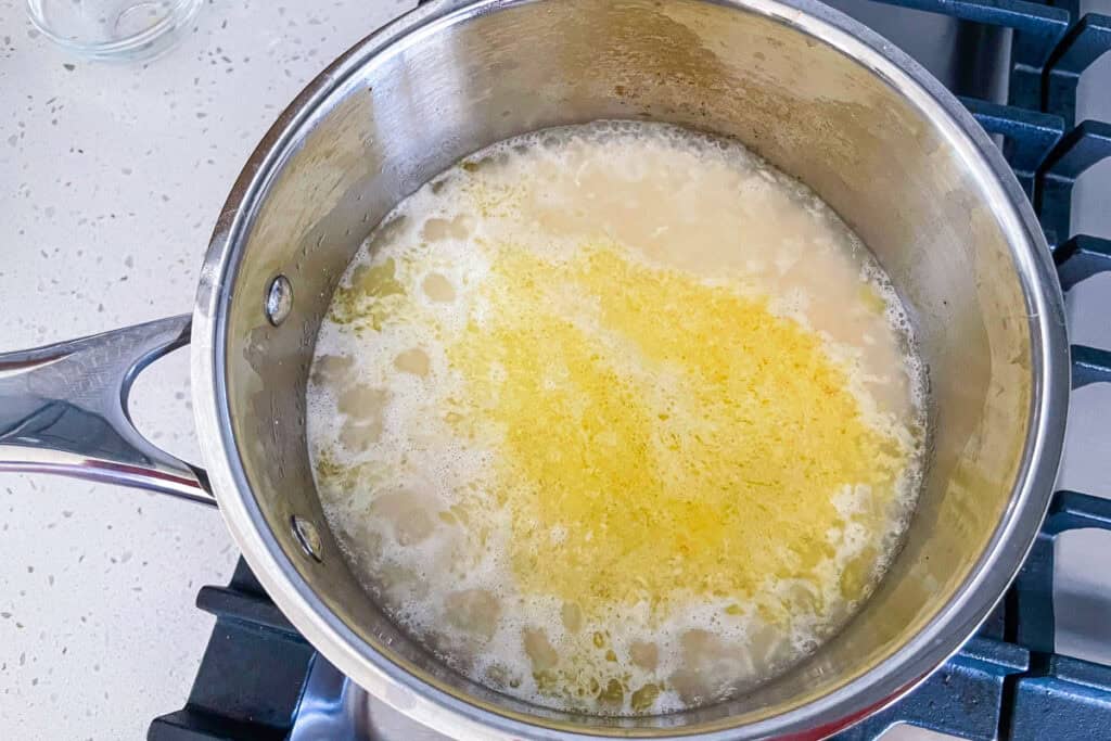 Garlic basmati rice at a rapid simmer before covering with a lid