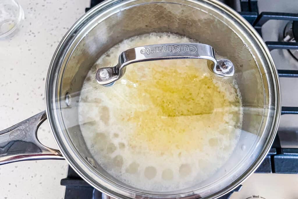 Cover the saucepan with a lid and cook the rice over low heat