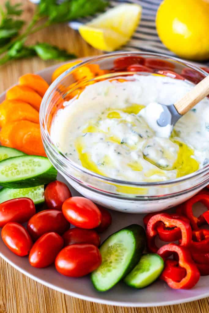 Small batch tzatziki sauce served with fresh vegetables for dipping